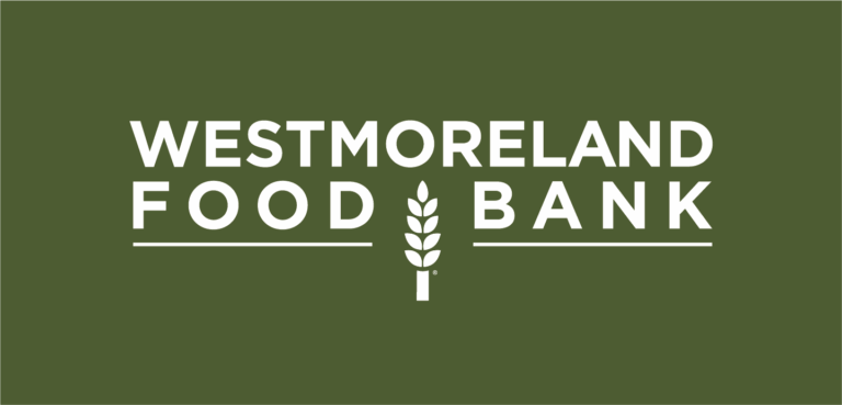 White text on an olive green background reads “Westmoreland Food Bank,” with a stylized wheat stalk between “Food” and “Bank.”.