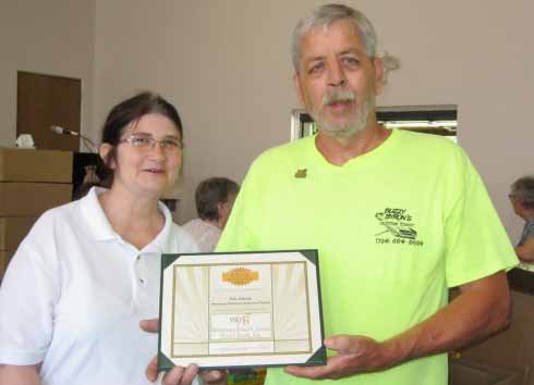 Capt Sue Thwaite and John Pokomo June Vol of Month 2018
