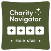 A green badge displaying Charity Navigator Four-Star with four white stars, indicating a high rating for a charity organization.